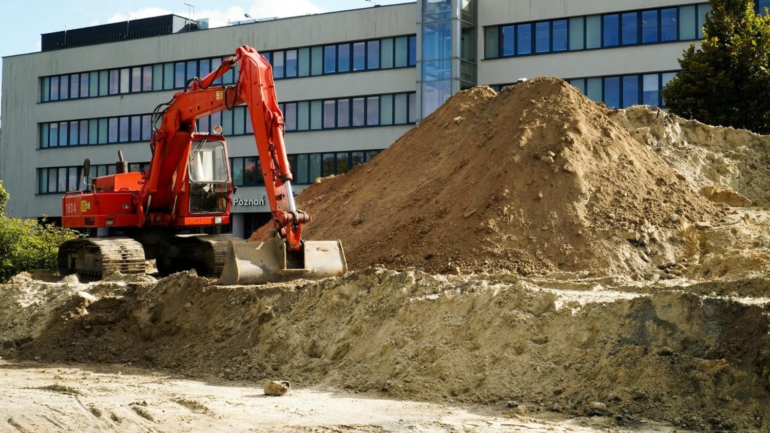 a construction vehicle in front of a building